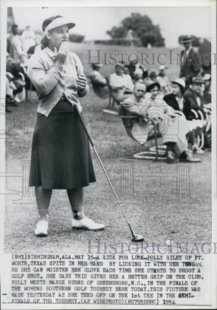 1954 Folly Riley Spits In Her Hand Before Taking Swing With Club - Historic Images