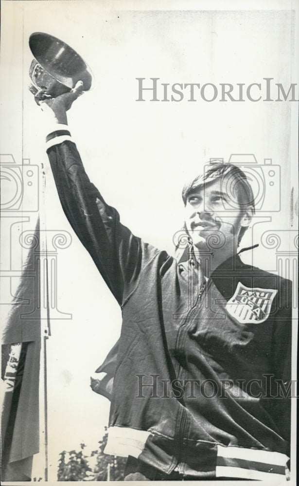 1977 Pat Matzdorf, the Wisconsin jumping jack, displays trophy. - Historic Images