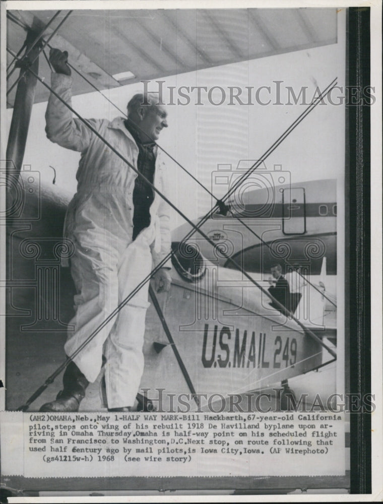 1968 Bill Hackbarth, on his re built byplane. - Historic Images