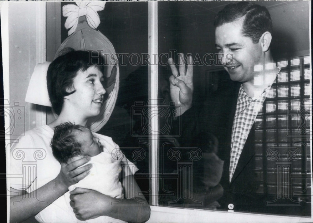 1962 Catherine zupan, nurse,Glenn Hall,  and his newborn. - Historic Images