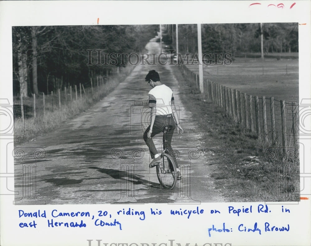 1985 Press Photo Donald Cameron Riding Unicycle East Hernando County - Historic Images