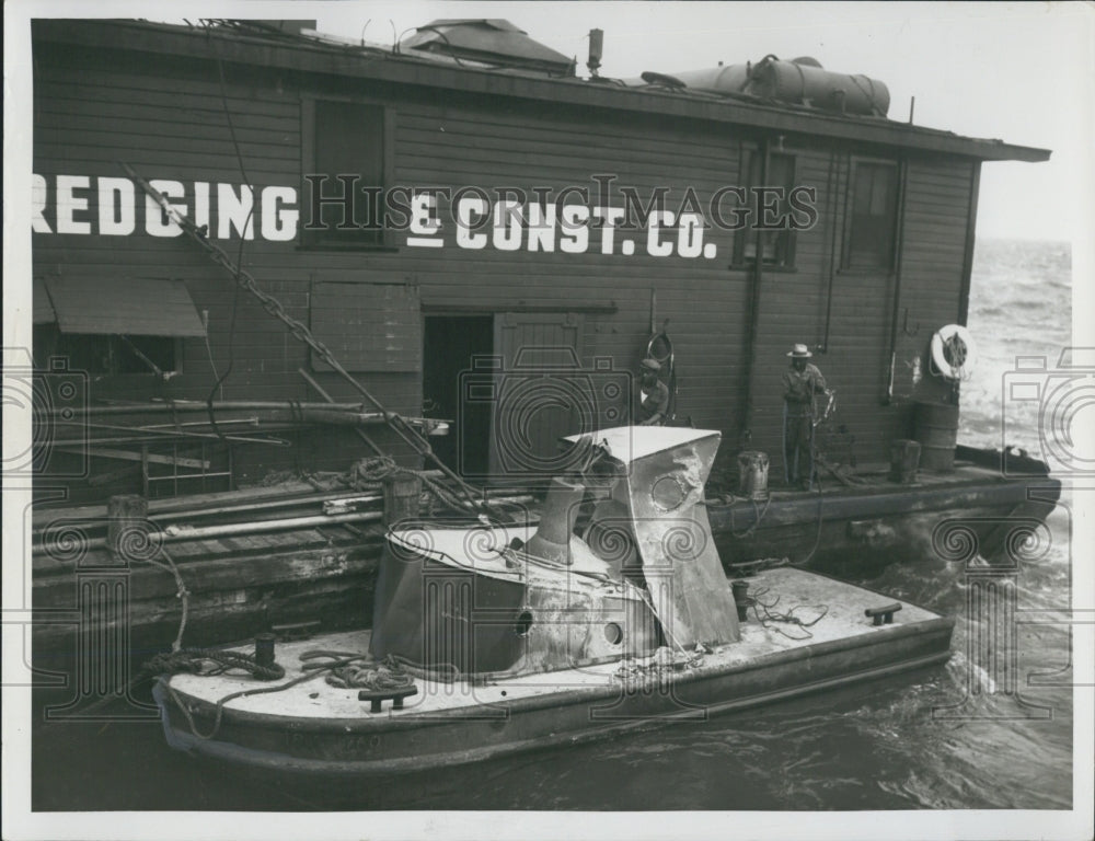 Press Photo Construction Company Damaged Tug In Water - Historic Images