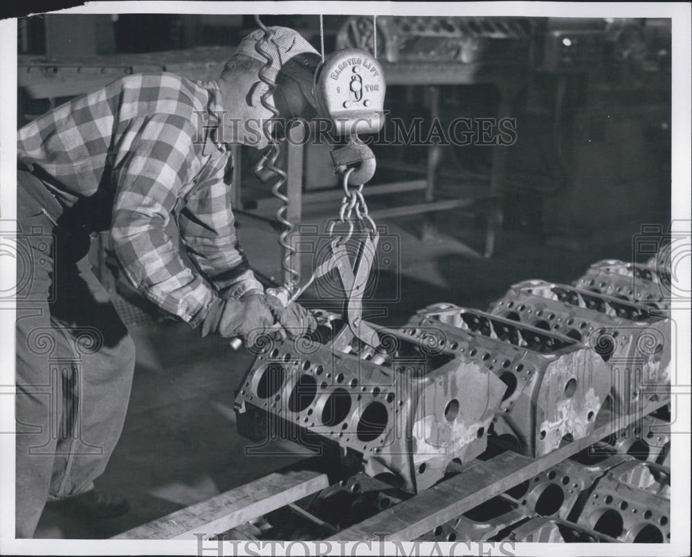 1956 Press Photo John Bane Stacks Finished DeSota Motor Blocks With Hoist - Historic Images