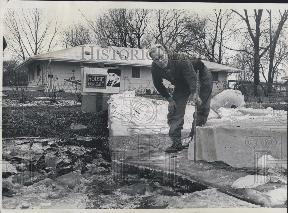 1971 Warren Atkins selling house because Rock River keep flooding it - Historic Images