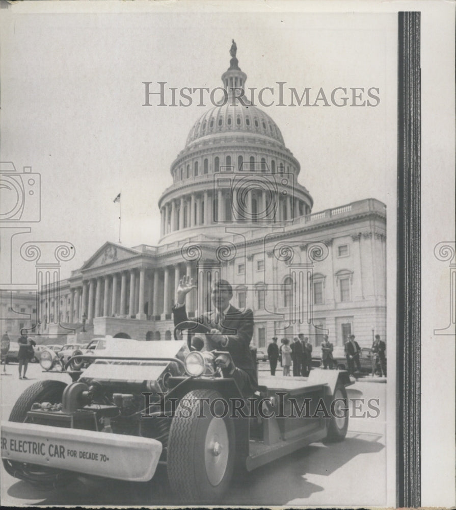 1970 Rep. Morris. K. Udall takes a drive in a new electric car - Historic Images