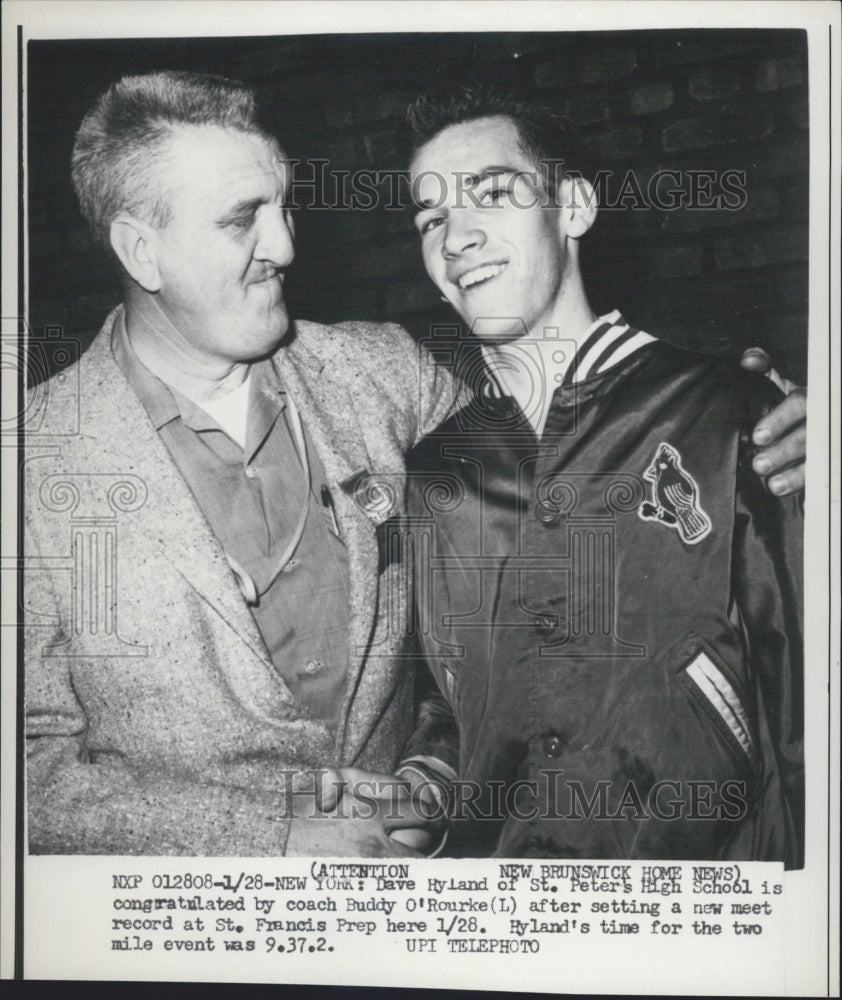1951 Dave Hyland is congratulated by coach O, Rourke - Historic Images