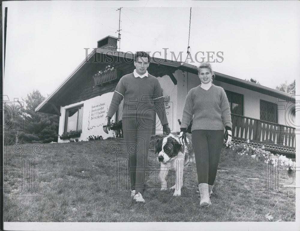 1968 Penny Pitou &amp; Egon Zimmerman walking with dog - Historic Images