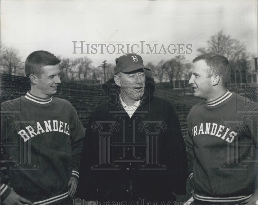 1961 2 brandels player with their coach. - Historic Images