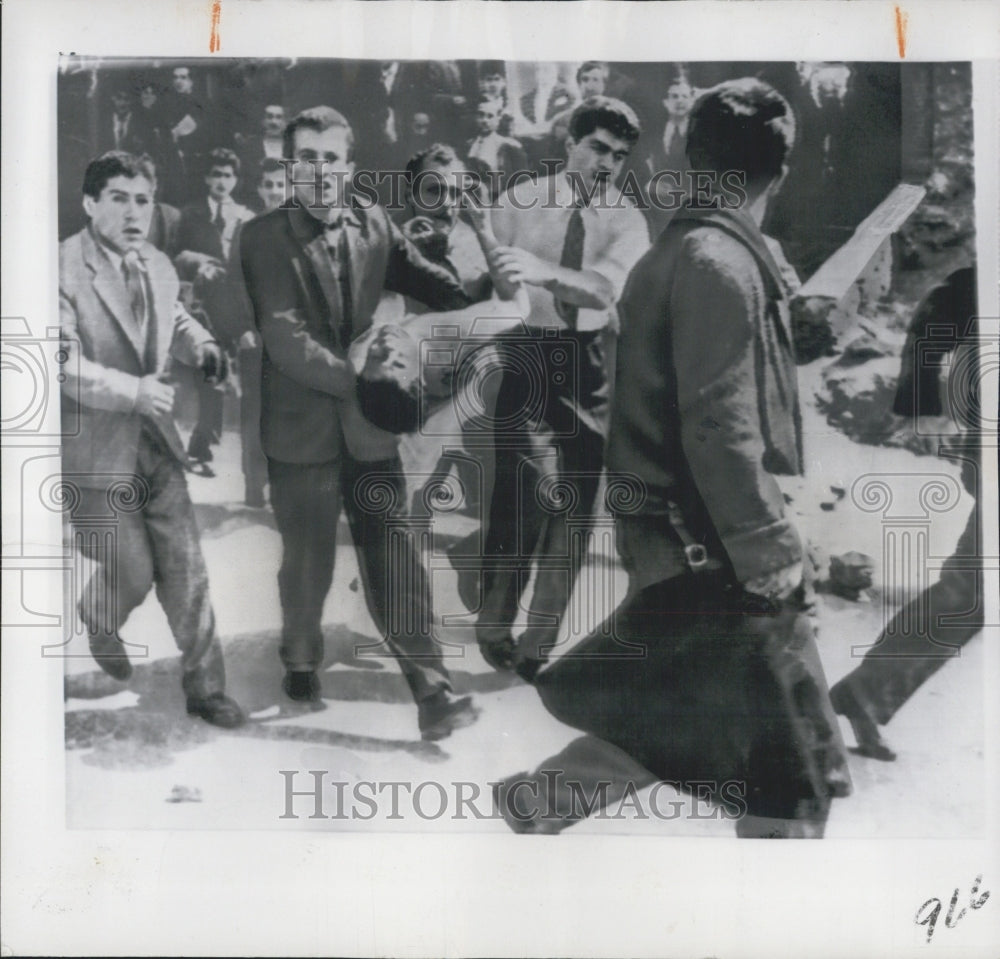 1960 Istanbul Turkey Students carry injured after clash with Police - Historic Images