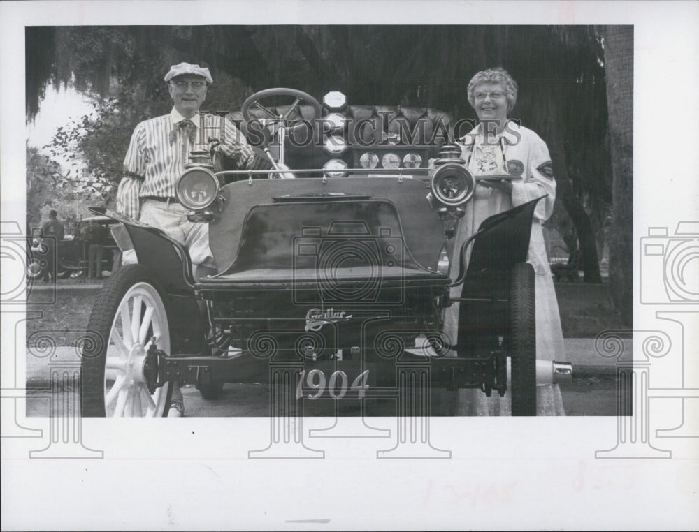 1970 Mr. and Mrs.Parke Robinson of St.Petersburg with 1904 Cadilliac - Historic Images