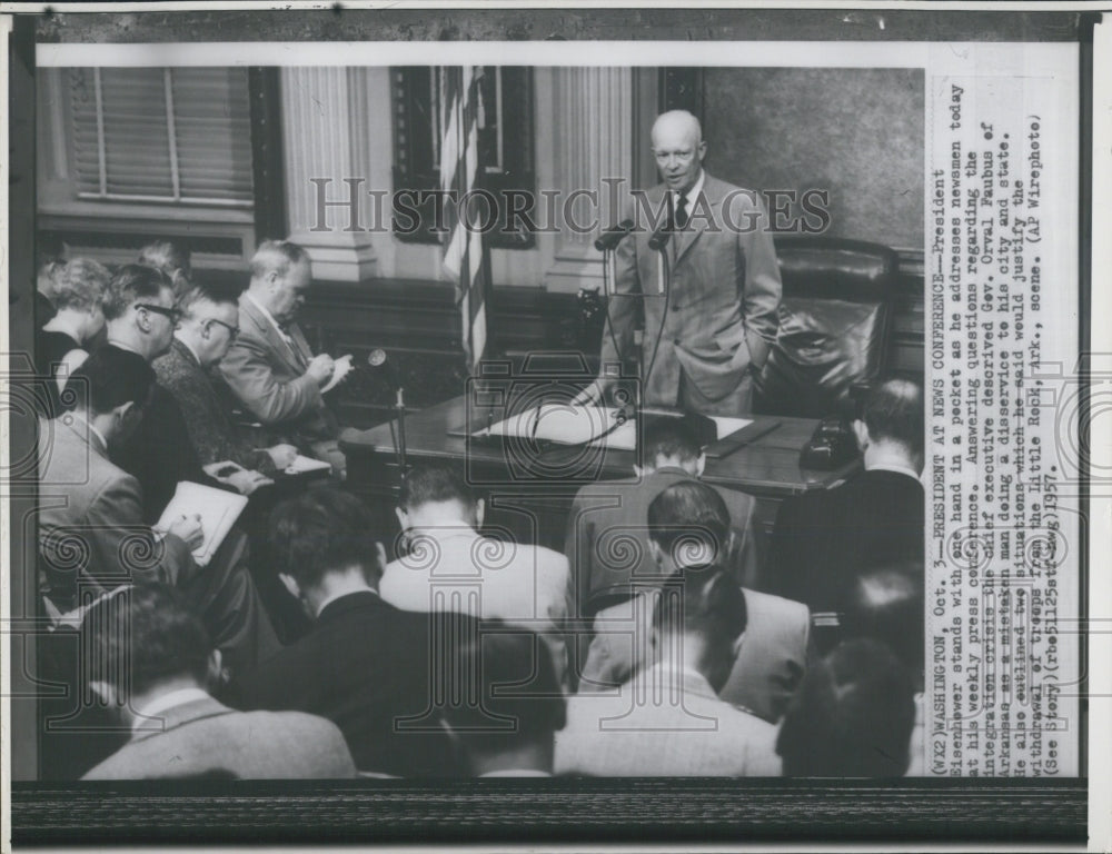 1957 President Eisenhewer stands with one hand. - Historic Images