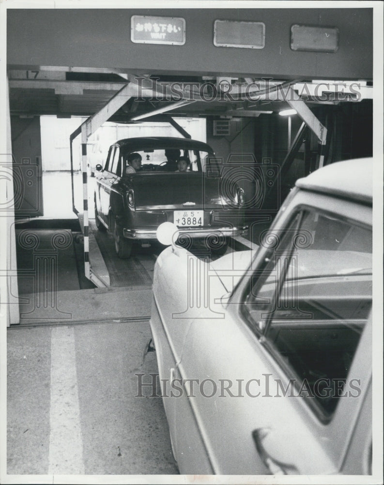 1964 parking car bottom platform garage space Tokyo - Historic Images