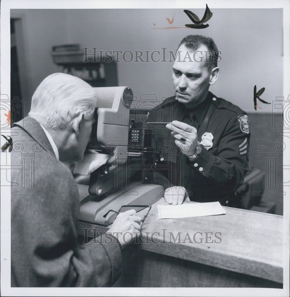 1966 Policeman, Robert Grower Gives Vision Test To Dale Rockwell - Historic Images