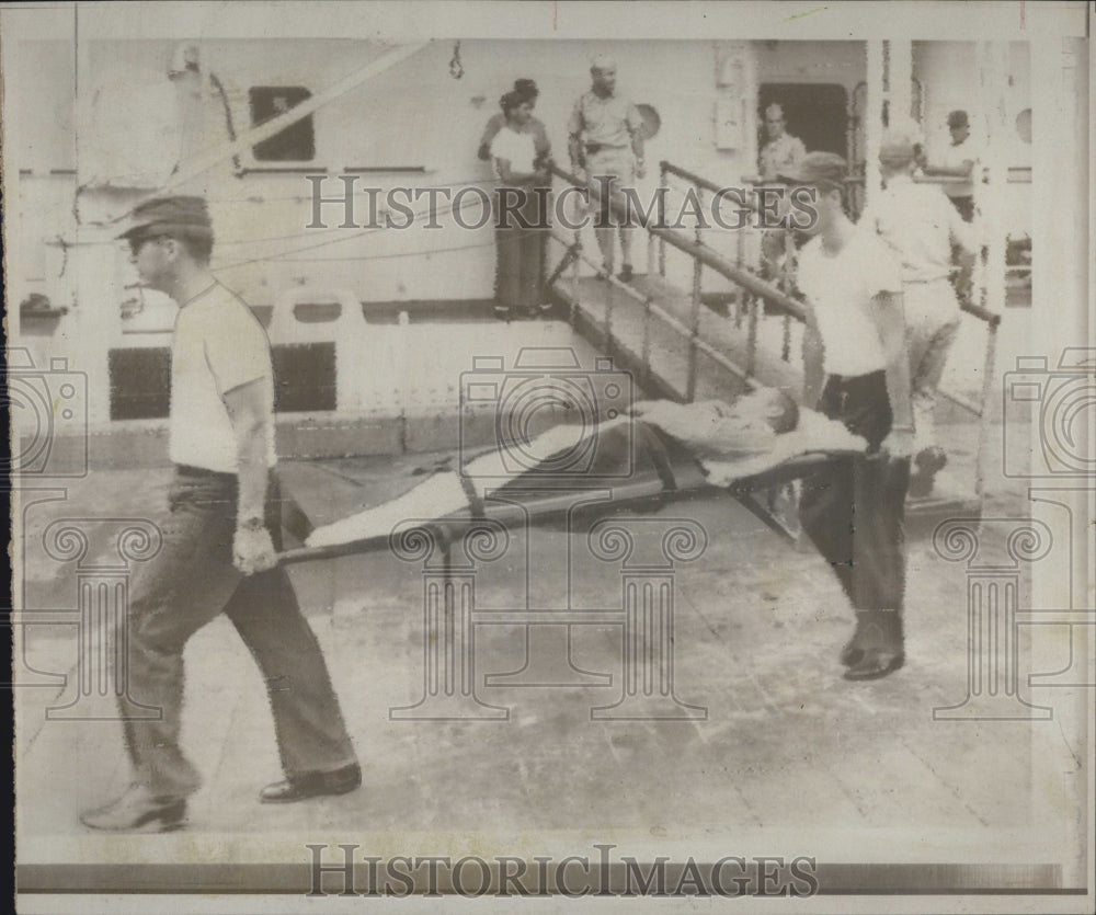 1967 Forrestal wounded carried from ship Navy Medics - Historic Images