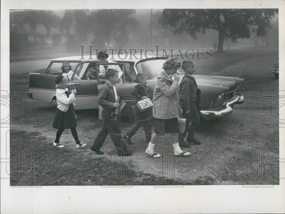 1965 Press Photo Children walking past a station wagon - RSG47621 - Historic Images