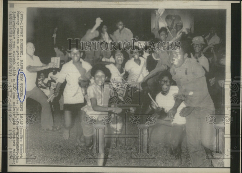 1975 Smiling faces erupt from Murray Stadium In New Guinea - Historic Images