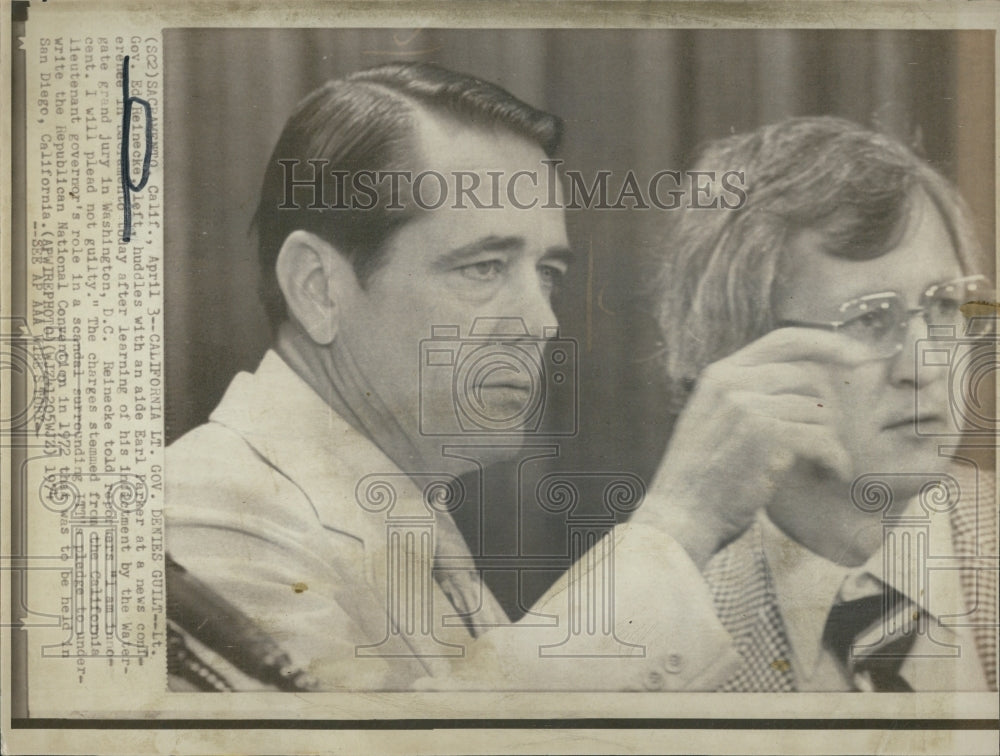 1974 Lt. Gov. Ed Reinecke, left, huddles with an aide Earl Parker - Historic Images