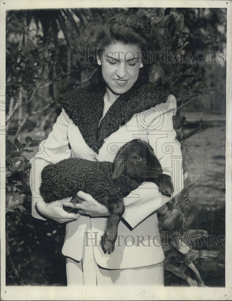 1946 Mrs. Bill Davis holds Caracul lamb - Historic Images