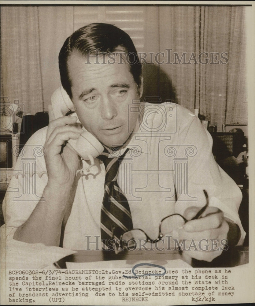 1974 Lt. Gov. Ed Reinecke using the phone for radio interviews - Historic Images