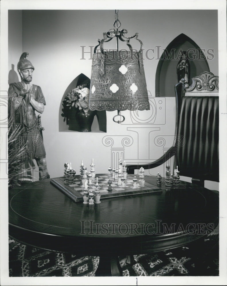 1971 chain hung lighting fixture, decorative room with chess table - Historic Images