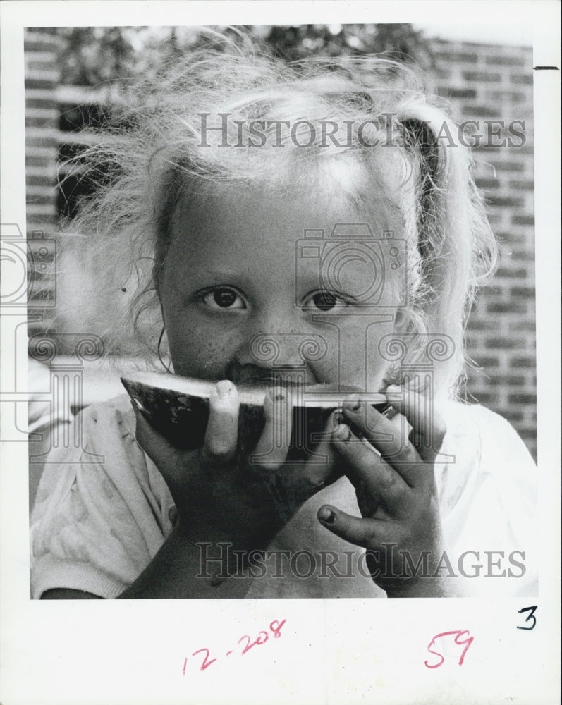 1985 Press Photo Nikole Eggers eats a watermelon - Historic Images