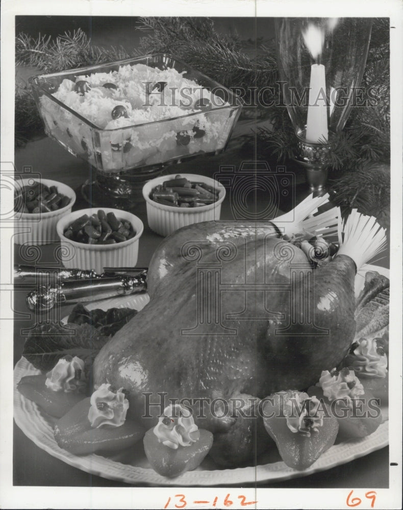 1978 Capon with cranberry pecan stuffing w/pear halves, green beans, - Historic Images