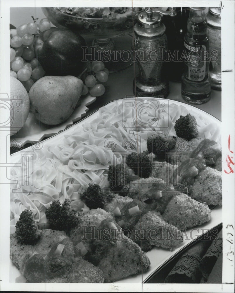 1977 Elegant Breaded Chicken Breasts breaded with italian spices - Historic Images