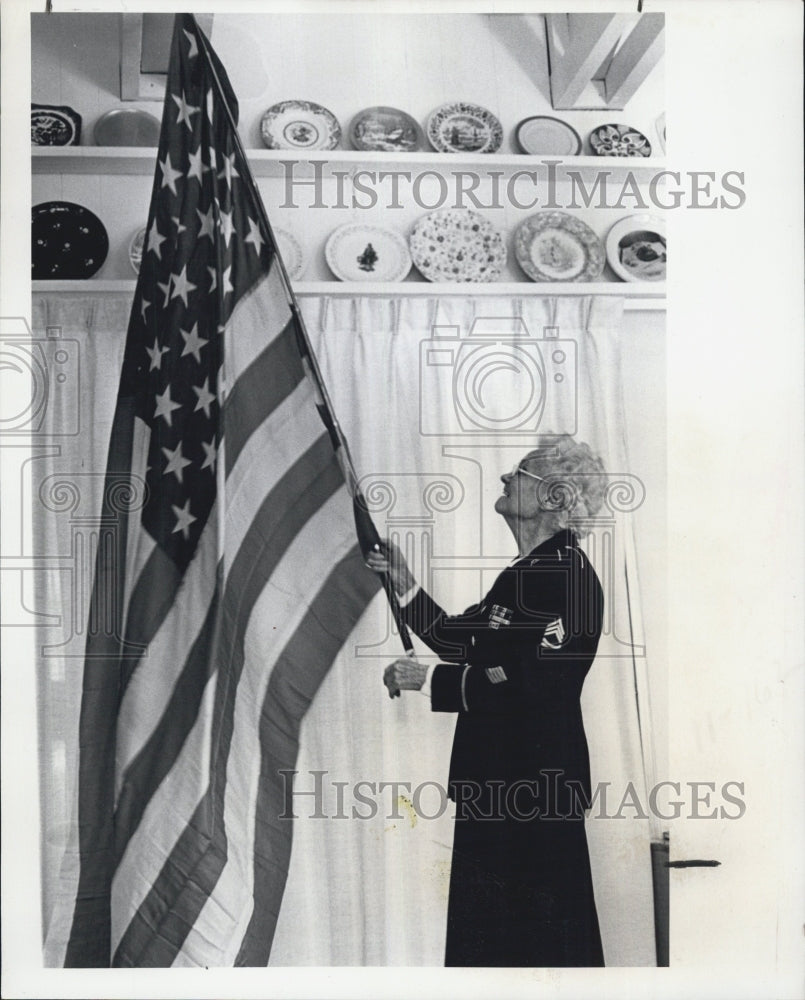 1977 Granny Harris waves the Flag. - Historic Images