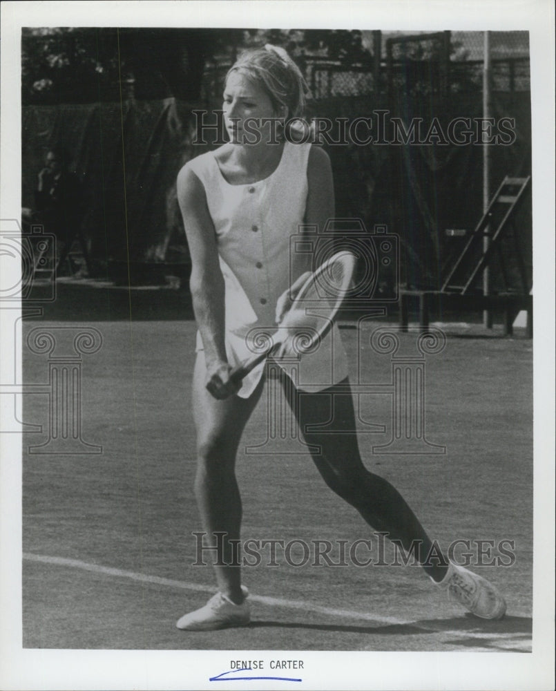 1971 Denise Carter while playing tennis. - Historic Images