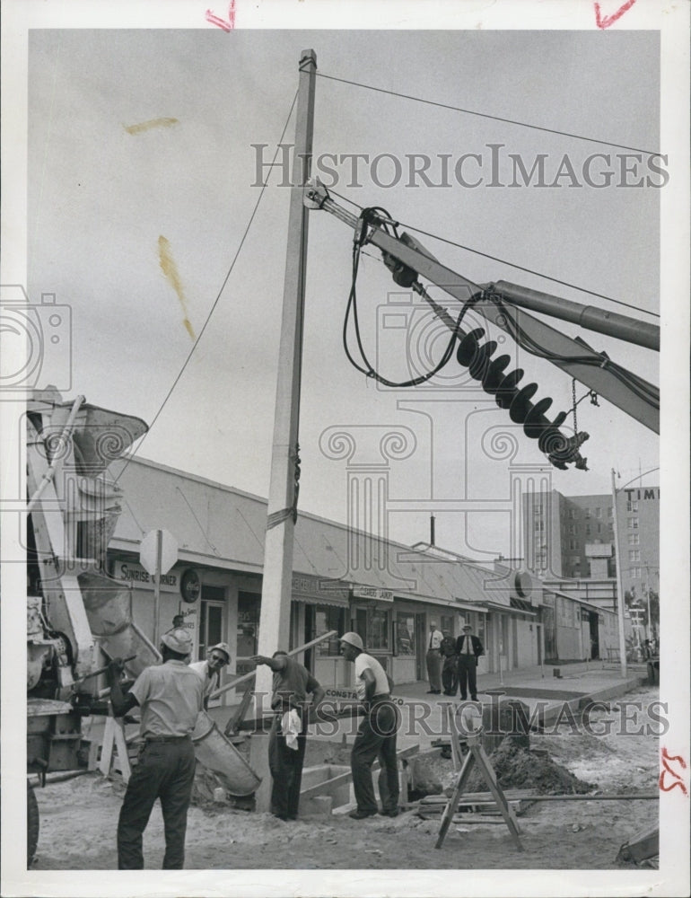 1963 of new light pole going up at First Ave. in St. Petersburg, FL - Historic Images