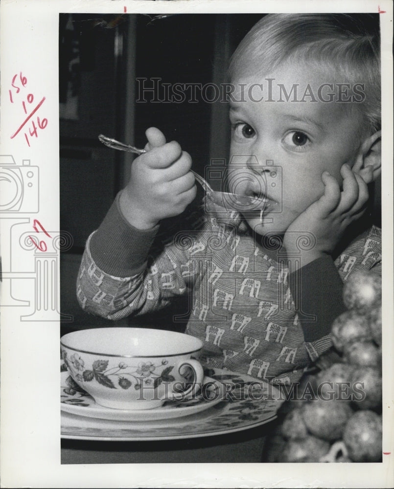 1972 child eating soup - Historic Images