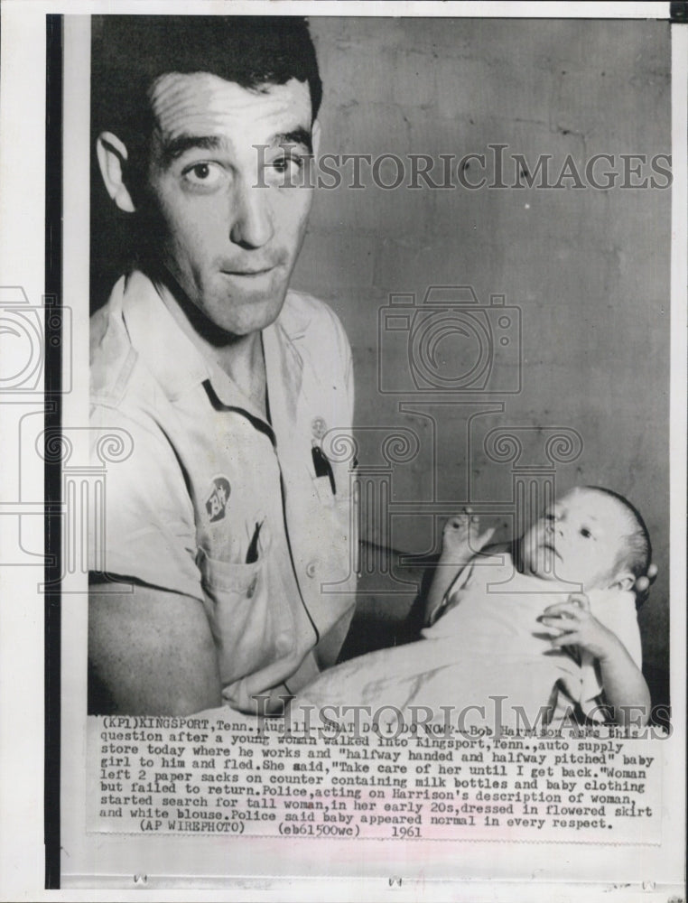 1961 Bob Harrison and a baby girl - Historic Images