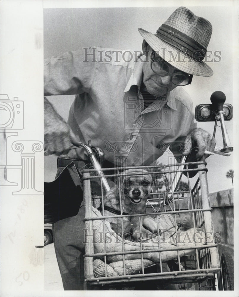 1977 Raplh Madsen and the dog who will be ride in his masters basket attached to bike. - Historic Images