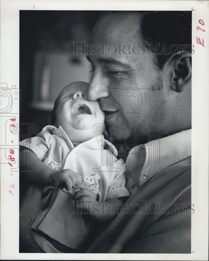 1972 Calvin Kanyuck with His Foster Baby - Historic Images