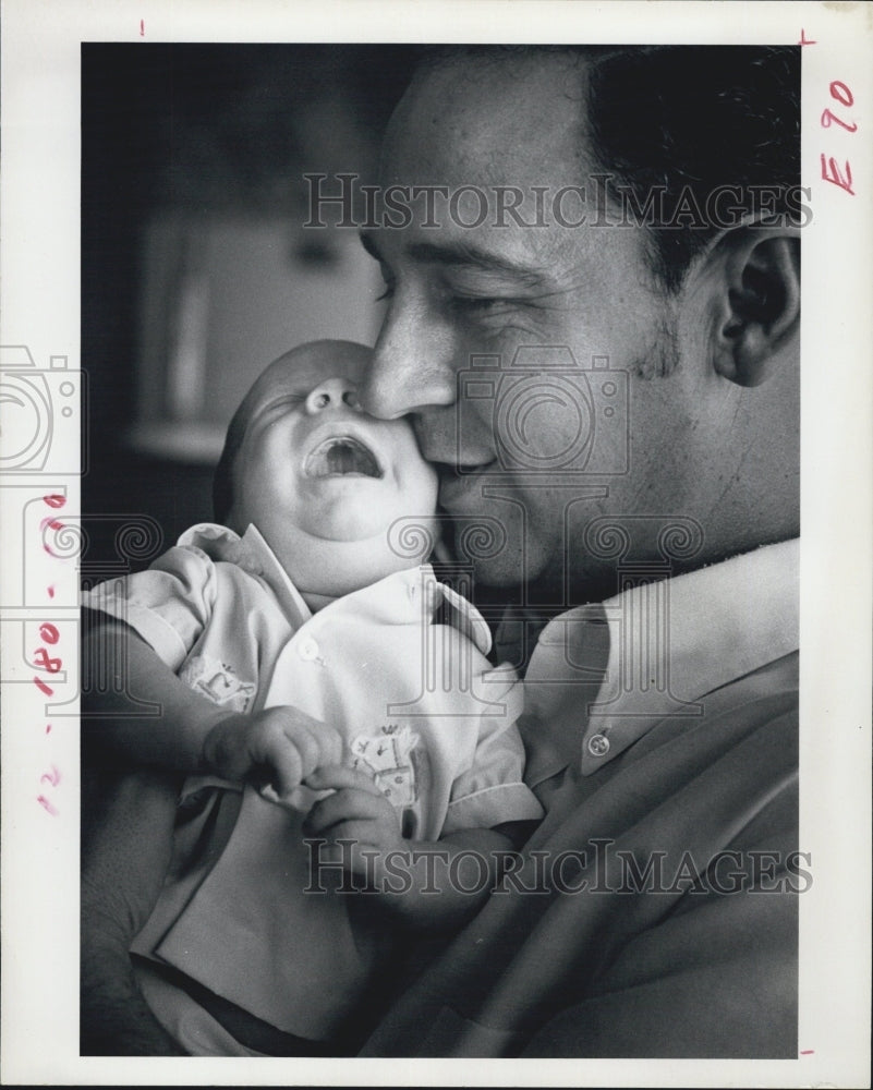 1972 Calvin Kanyuck with His Foster Baby - Historic Images