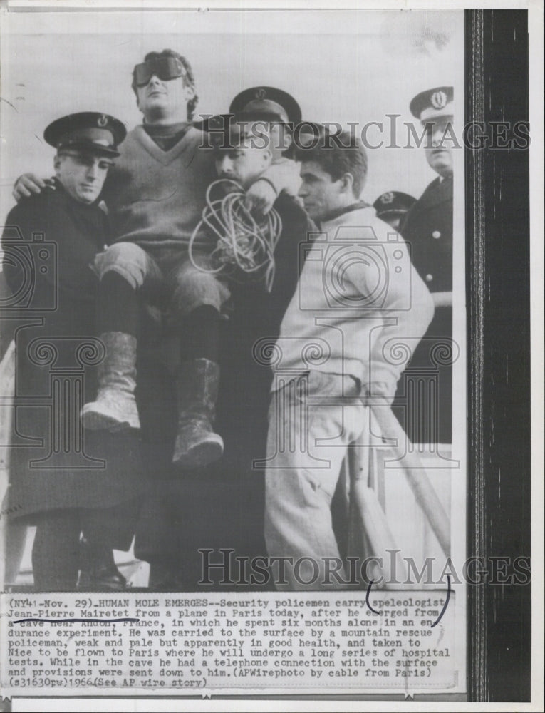 1966 Speleologist Jean-Pierre Mairetet being carried by police - Historic Images