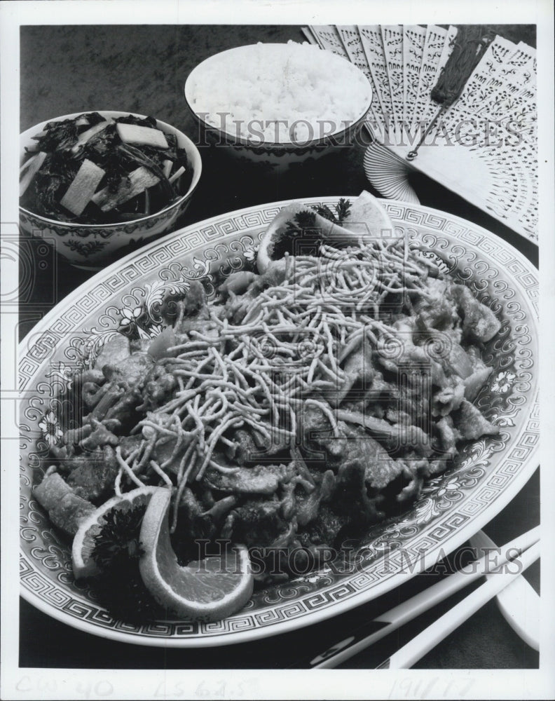 1983 Press Photo Chinese orange beef complemented by a side dish of spinach and - Historic Images