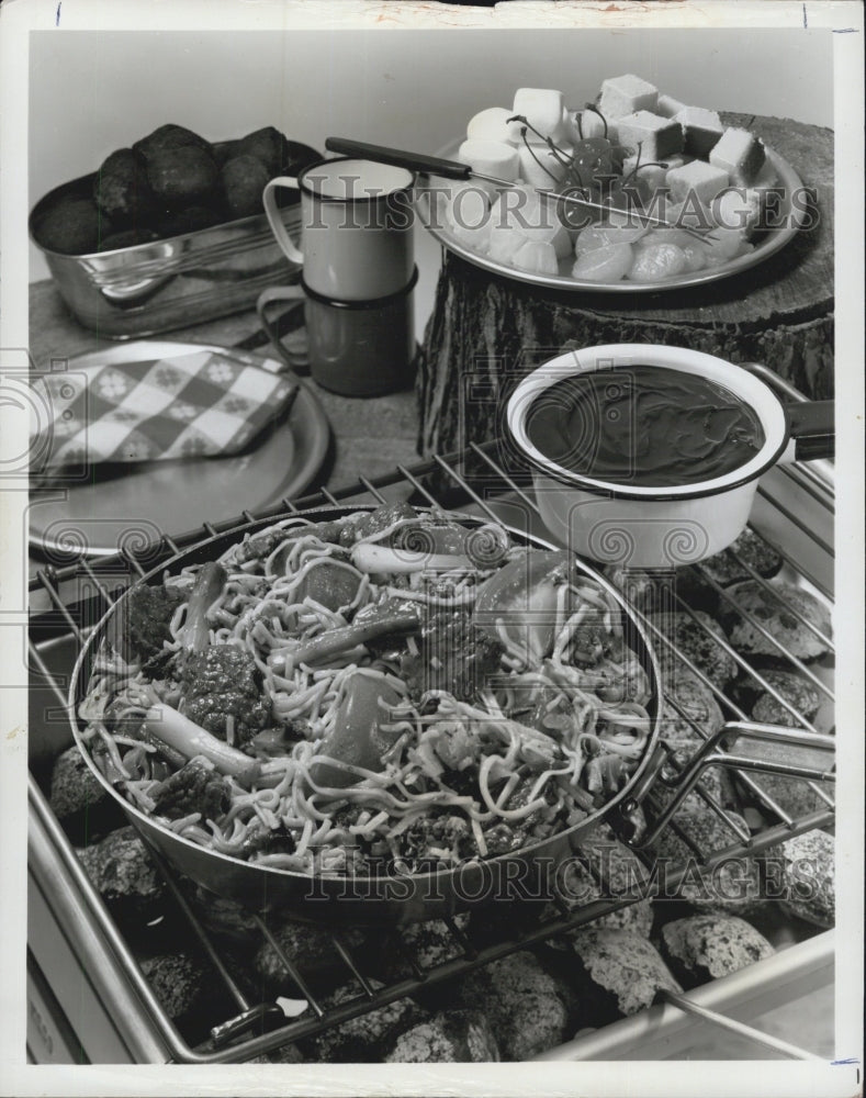 1975 A picture of Saucy beef Lo Mein. Can be cooked over charcoal campfire for an unusua - Historic Images