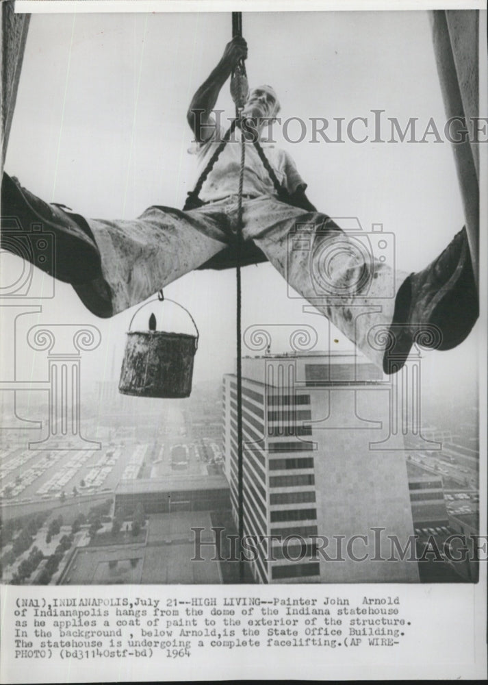 1964 Painter John Arnold hangs from the dome of Indiana Statehouse. - Historic Images
