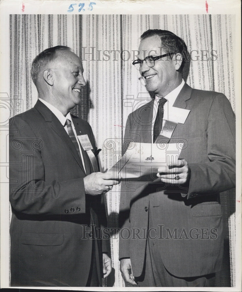 1964 Rudy Rodriguez(left) and Lewis Homer talks about county government discussion. - Historic Images