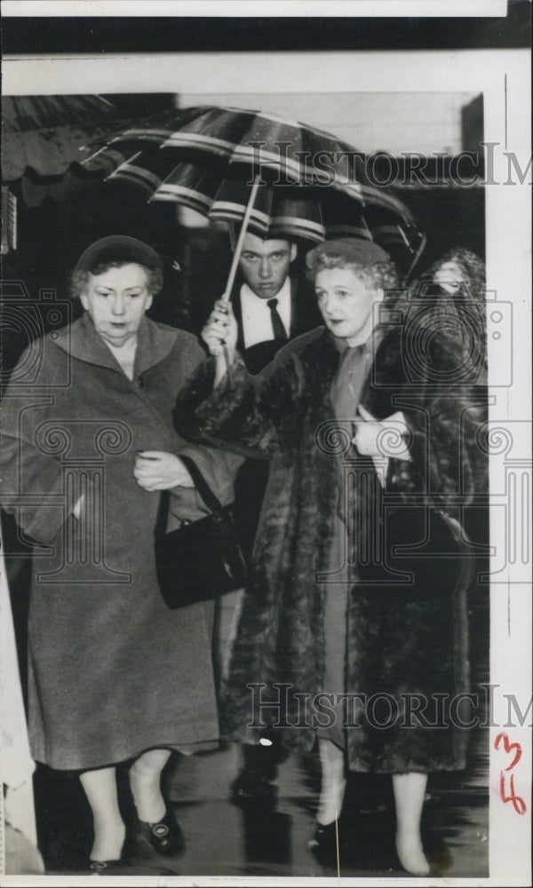 1956 two women man umbrella - Historic Images