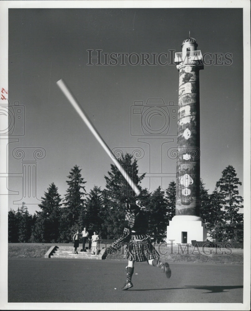 1960 Big Men Throw Caber at Highland Games Event In Astoria Oregon - Historic Images