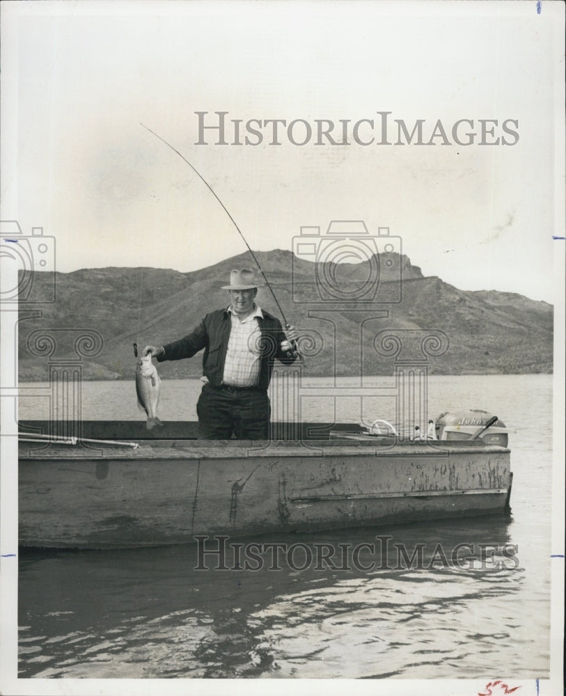 Press Photo Fisherman Holding Fish IN Owhee Lake On Oregon & Idaho Border - Historic Images
