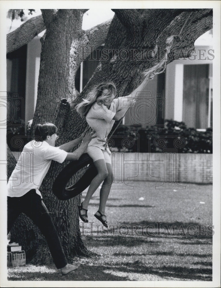 1969 Florida College Students Playing On Tire Swing - Historic Images