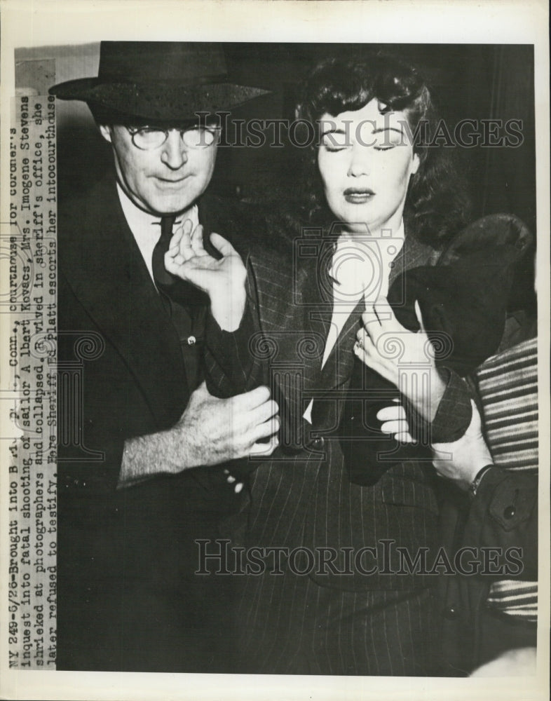 1945 Press Photo Mrs. Imogene Stevens being escorted by Sheriff Ed Platt - Historic Images