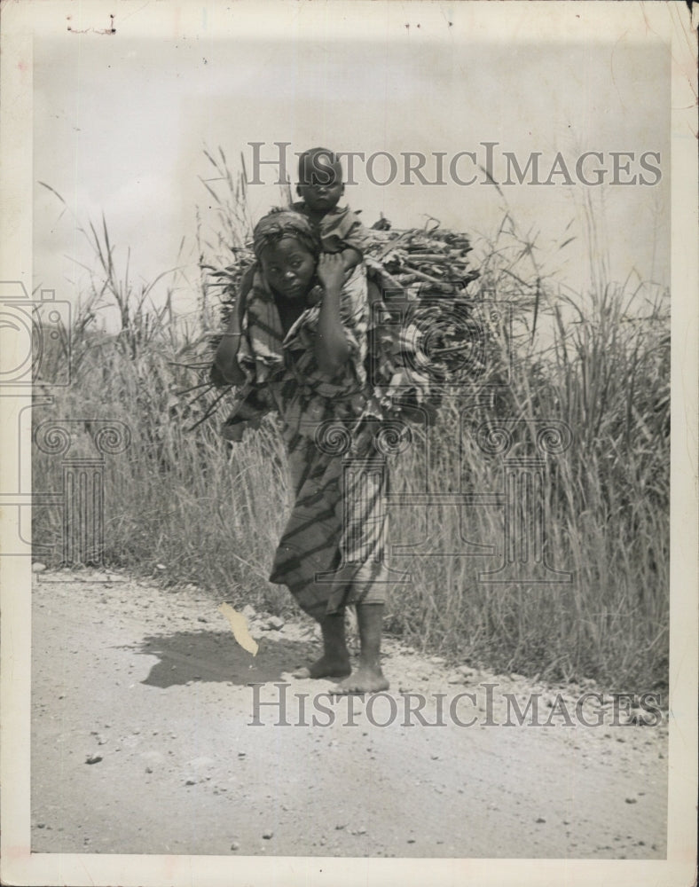 1954 Belgian Congo native woman carries child load faggots road - Historic Images