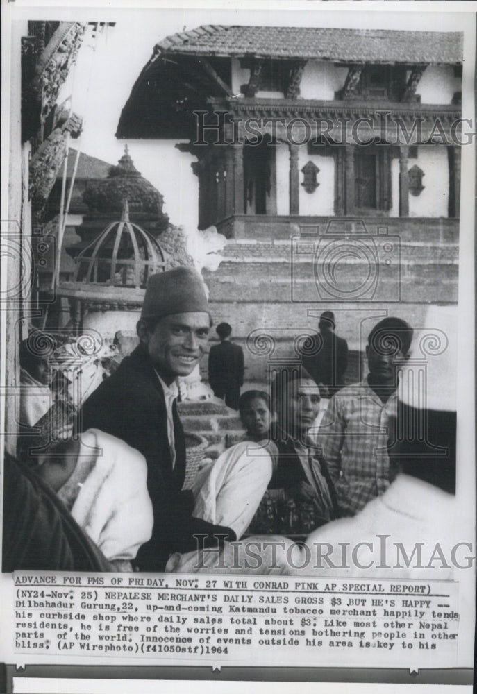 1964 Nepalese Happily smiles his curbside shop. - Historic Images