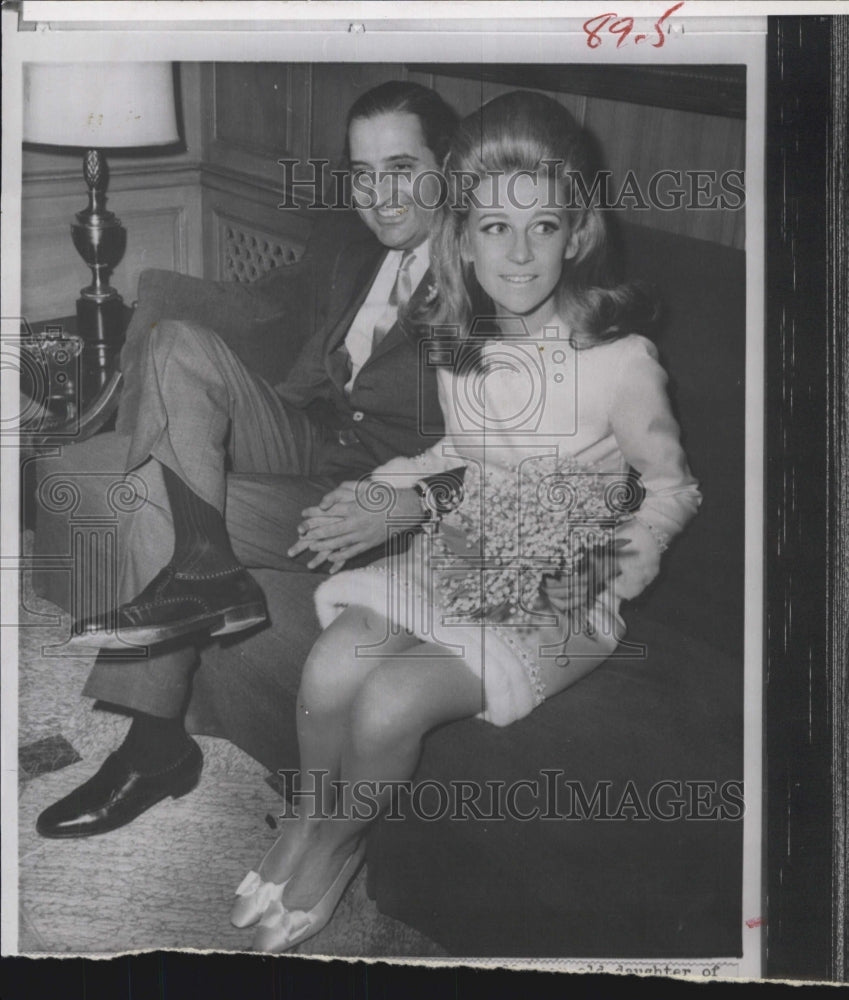 1965 Anne Ford and her Husband in the lobby in New york. - Historic Images