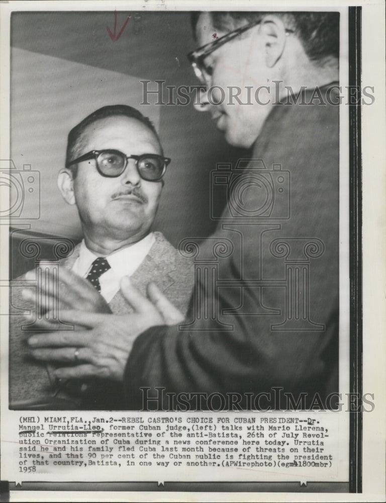1958 Former Cuban Judge Manuel Urrutia-Lleo Chats With Mario Llerena - Historic Images