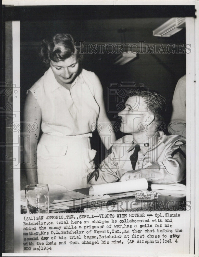 1954 Cpl. Claude Batchelor on trial, visited by his mother. - Historic Images